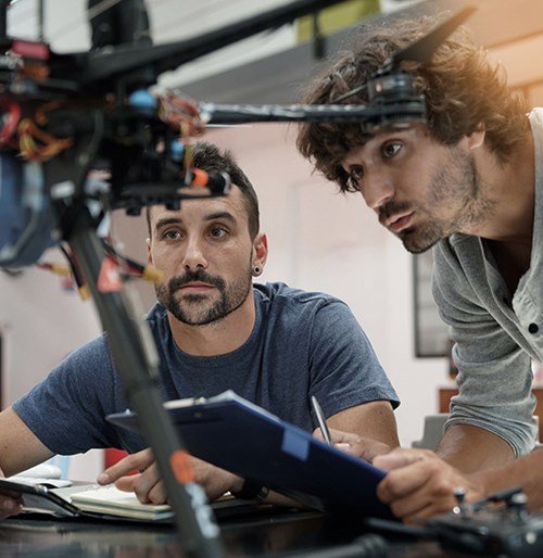 Two engineers work on missile technology