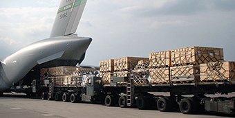 A Tunner cargo loader entering the back of an aircraft