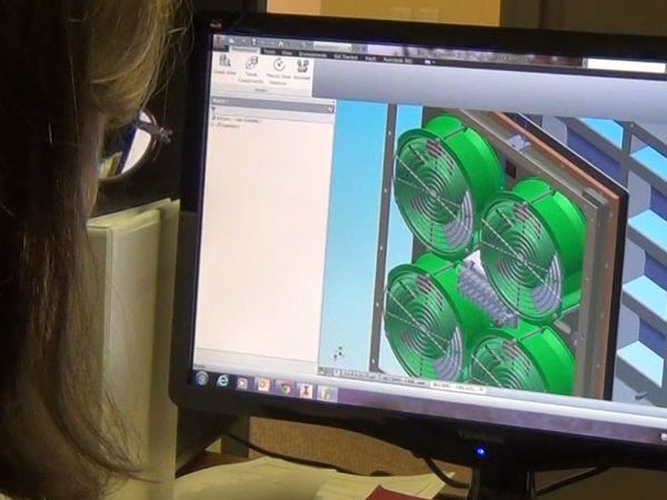Naval sustainment engineer working on a fan design